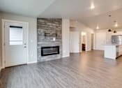 Thumbnail 5 of 15 - Living room with fireplace at Mezzo Apartments, Fargo, ND
