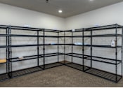 Thumbnail 9 of 12 - Empty shelving unit in a room.
