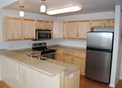 Thumbnail 2 of 10 - Open Kitchen at Urban Crossing Apartments, Fargo, North Dakota