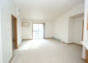 Thumbnail 4 of 6 - A room with a window and a door.
