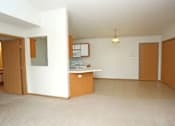 Thumbnail 3 of 6 - A room with a desk and a cabinet.