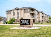Thumbnail 1 of 10 - an image of the shadow bay apartments sign