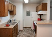 Thumbnail 2 of 6 - Fully Furnished Kitchen at Wellington Townhomes, Grand Forks, North Dakota