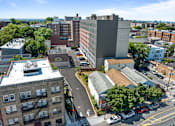 Thumbnail 15 of 25 - an aerial view of a city with buildings and trees