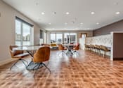 Thumbnail 18 of 25 - a conference room with a table and chairs and a large window