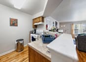 Thumbnail 22 of 23 - a kitchen with an island and a living room