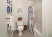 Thumbnail 8 of 19 - Phoenixville apartment bathroom with bathtub, and toilet at Yardley Crossing