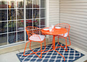 Thumbnail 14 of 19 - Private patio/balcony with a mini rug and dining table at Westridge Gardens