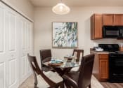 Thumbnail 29 of 42 - Dining Room and Kitchen