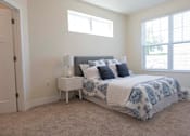 Thumbnail 5 of 29 - Master Bedroom With Large Windows at Cedar Place Apartments, Cedarburg, WI