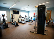 Thumbnail 9 of 29 - Fitness Center With Modern Equipment at Cedar Place Apartments, Wisconsin