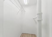 Thumbnail 68 of 230 - A white room with a white column and a white shelf.
