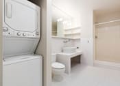 Thumbnail 11 of 12 - a bathroom with a washer and dryer in it and a sink and toilet