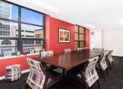Thumbnail 28 of 45 - a conference room with a table and chairs and a large window