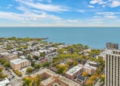 Thumbnail 5 of 45 - an aerial view of a city with the ocean in the background