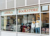 Thumbnail 43 of 45 - a window display of a bookstore with mannequins in the window