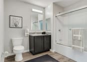 Thumbnail 20 of 45 - a bathroom with a sink toilet and a shower