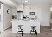 Thumbnail 2 of 50 - Fitted Kitchen With Island Dining at 23rd Place Apartments, Chicago, Illinois