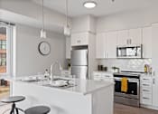 Thumbnail 4 of 50 - Gourmet Kitchen With Island at 23rd Place Apartments, Chicago, IL