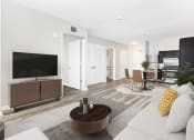 Thumbnail 12 of 45 - a living room with a couch and a tv