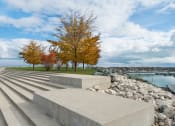 Thumbnail 37 of 39 - Image of concrete steps, with tree and Lake Michigan in the background at Eden Commons, Illinois, 60616