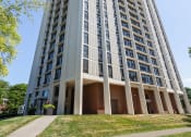 Thumbnail 29 of 39 - a tall building with many windows and a sidewalk in front of it at Eden Commons, Illinois, 60616