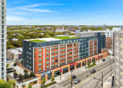 Thumbnail 1 of 45 - a large building with a green roof on a city street