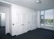 Thumbnail 26 of 59 - Image of Park Boulevard IIB bedroom with large window and closets.
