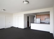 Thumbnail 30 of 59 - Image of Park boulevard IIB living room with view into kitchen area, and entry way