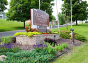 Thumbnail 17 of 17 - Property Entrance with monument sign surrounded by landscaping located off of Rahn Rd on Cedar Grove Parkway