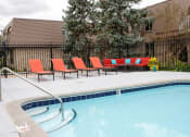 Thumbnail 10 of 17 - Private apartment pool deck and lounge area with outdoor furniture and controlled access to pool. 