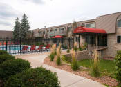 Thumbnail 13 of 17 - Front entrance of property near pool, pool deck, and grilling amenities