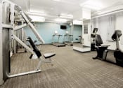 Thumbnail 27 of 39 - Fitness center with cardio and weight lifting machines at Eden Commons, Chicago, 60616
