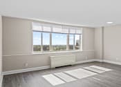 Thumbnail 12 of 19 - Spacious apartment interior with large windows at Dominion Towers Apartments, Arlington, VA