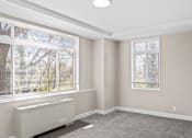 Thumbnail 5 of 19 - Bright unfurnished room with natural light at Dominion Towers Apartments, Arlington, VA
