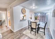 Thumbnail 30 of 37 - Dining area with glass table and upholstered chairs at Le Montreaux Apartments, Austin, TX 78759