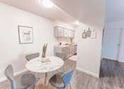 Thumbnail 23 of 33 - Dining area with marble table and gray chairs at Cantera Apartments, El Paso, 79935