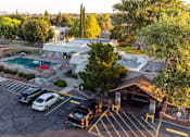 Thumbnail 33 of 33 - Aerial view of parking lot and pool area at Cantera Apartments, El Paso, TX