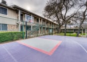 Thumbnail 4 of 36 - a basketball court at Juniper Springs Apartments, Austin, TX
