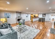 Thumbnail 16 of 37 - Open concept living area with kitchen and dining space at Le Montreaux Apartments, Texas, 78759
