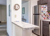 Thumbnail 3 of 18 - marble counter top and a stainless steel refrigerator