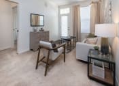 Thumbnail 4 of 44 - a living room with a couch and a chair at Ardmore at the Trail, Indian Trail, NC