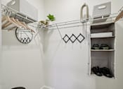 Thumbnail 17 of 60 - White closet with shoe rack and chair at Ardmore Meadows, North Carolina