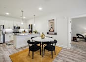 Thumbnail 13 of 60 - Modern kitchen with dining table at Ardmore Meadows, Whitsett, NC