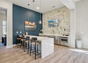 Thumbnail 38 of 60 - Kitchen with white island and bar stools at Ardmore Meadows, Whitsett, NC