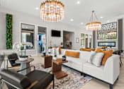 Thumbnail 1 of 30 - A modern living room with a white sofa and a large chandelier.