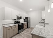 Thumbnail 23 of 30 - A kitchen with granite countertops and stainless steel appliances.