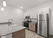 Thumbnail 24 of 30 - A modern kitchen with a granite countertop and stainless steel appliances.