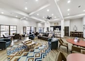 Thumbnail 8 of 8 - a living room with couches and chairs and a rug