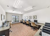 Thumbnail 2 of 8 - a conference room with desks and chairs and a piano